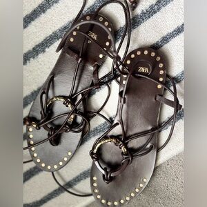 New Zara Dark Brown Leather sandals with golden details.